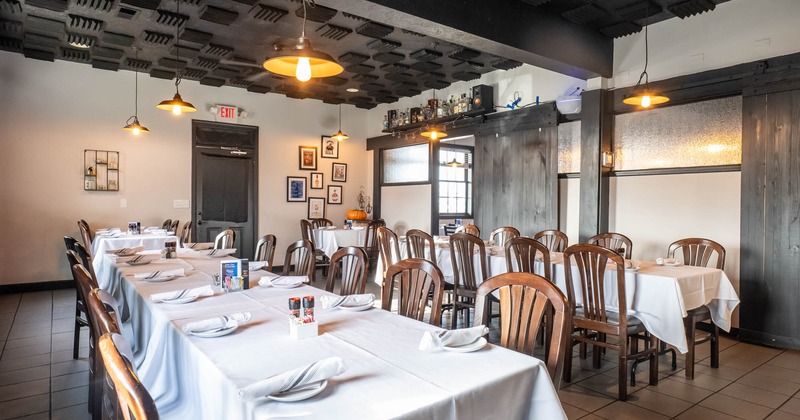 Interior, long dining tables with chairs ready for guests