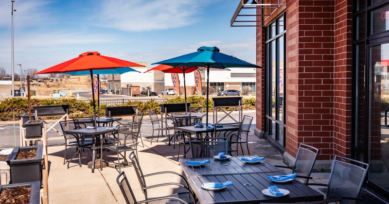 Exterior, tables with parasols and chairs