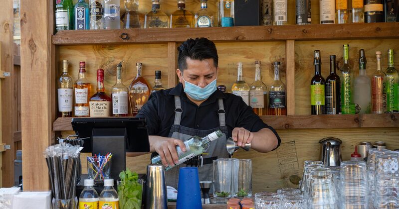 Staff member pouring drink