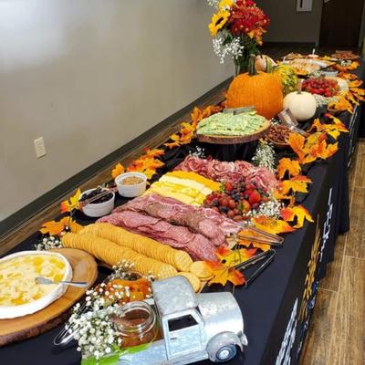 Catering food displayed on a table decorated with autumn details