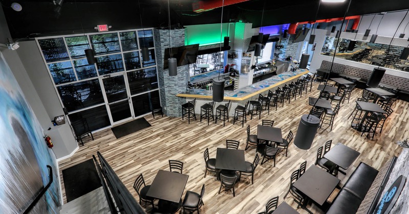 Interior, view of seating area and bar from upstairs