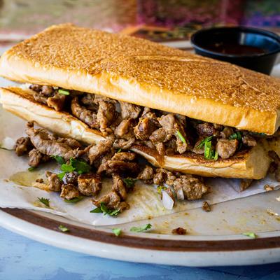 Steak Torta, with beans, onions, and cilantro.