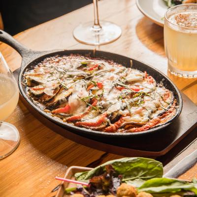 Eggplant parm served in cast-iron skillet