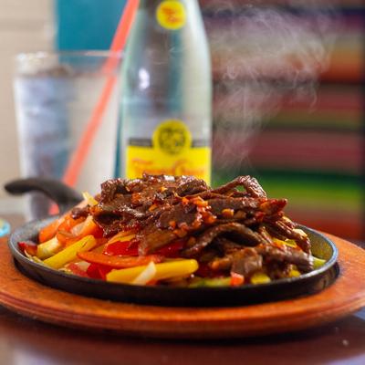 Steak Fajitas, with grilled onions and bell peppers.