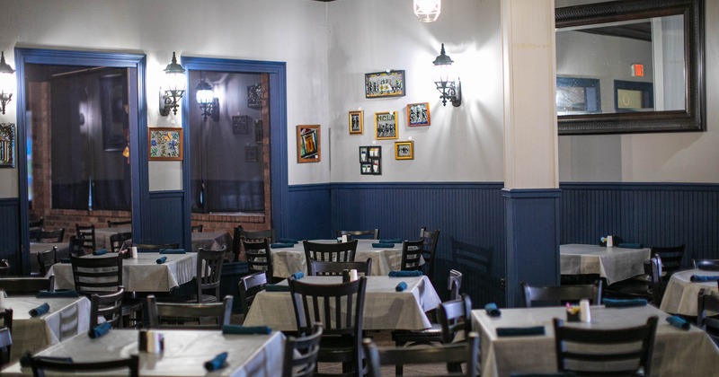 Interior, tables and chairs set for guests