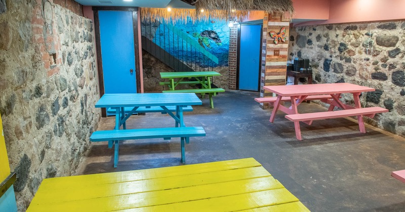 Inside, seating area, colorful wooden benches