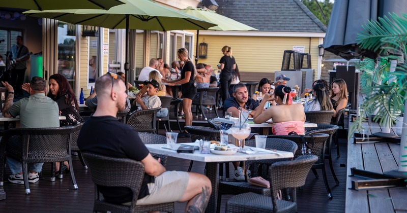 Terrace, tables and chairs, diner time, people