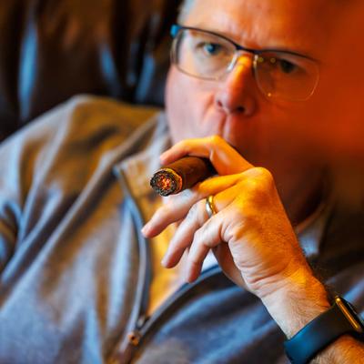 Customer smoking a cigar.