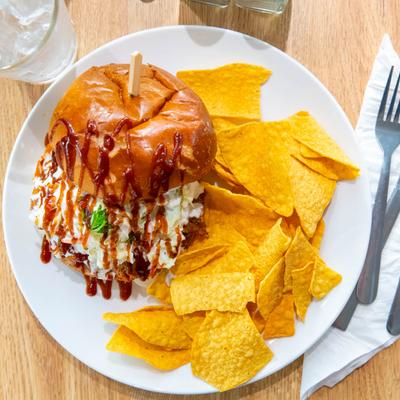 Carolina BBQ sandwich served with corn chips.