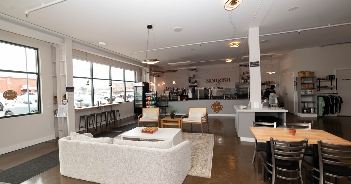 Interior with sofa and table seating and a view of the counter area