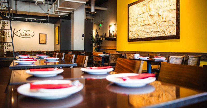 Interior, tables set for guests in dining area