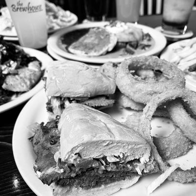 Tri Tip Sandwich with onion rings.