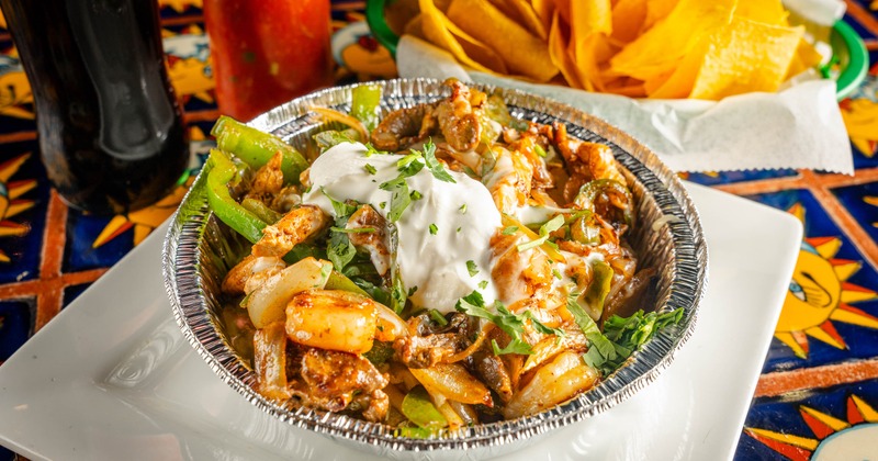 Fajita Potato salad served alongside basket of tortilla chips