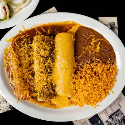 Three smothered burritos, served with rice, and refried beans.