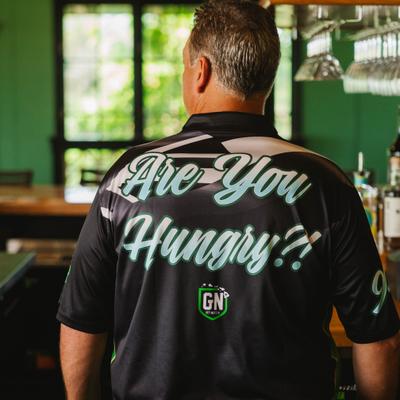 Person wearing a shirt reading Are You Hungry.