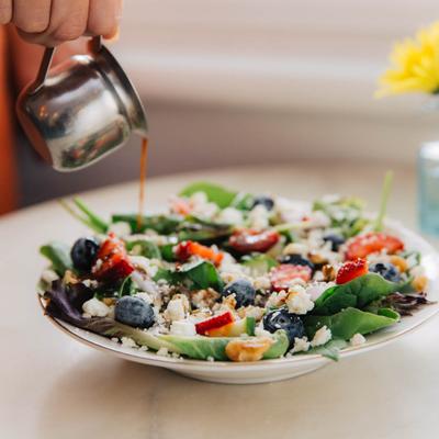 Berry salad, with mixed greens, feta, cucumber, red onion, and walnuts