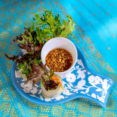 Fresh Basil Rolls served with lettuce and a peanut dipping sauce.