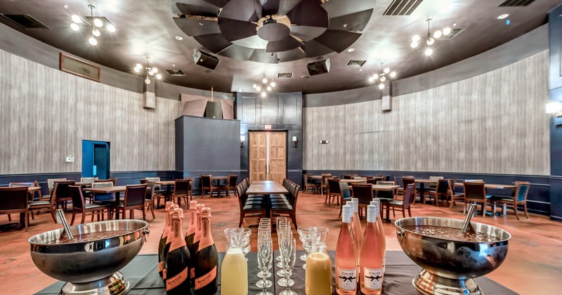 Interior, buffet table with drinks, seating area in the background