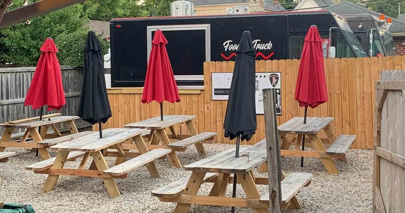Exterior, wooden tables with benches ready for guests