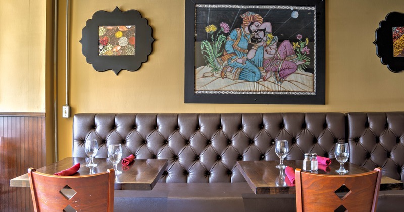 Cozy restaurant booth with brown tufted seating