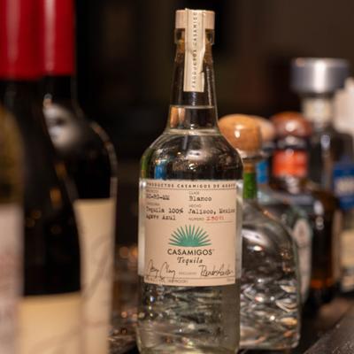 Bottle of Tequila served alongside other bottles.