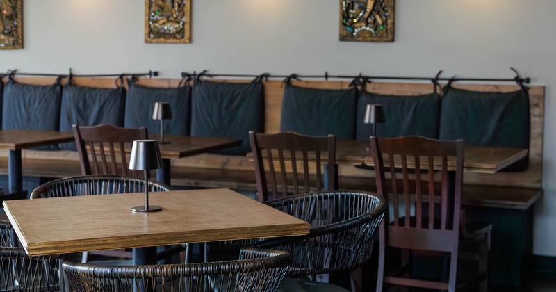 Restaurant seating area with tables and wall decorations