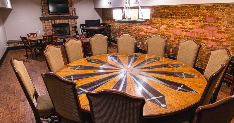 Round diner table, fireplace behind