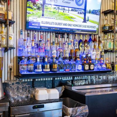 A well stocked bar with various bottles of liquor.