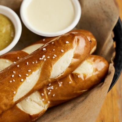 Pretzel sticks served with two dipping sauces.