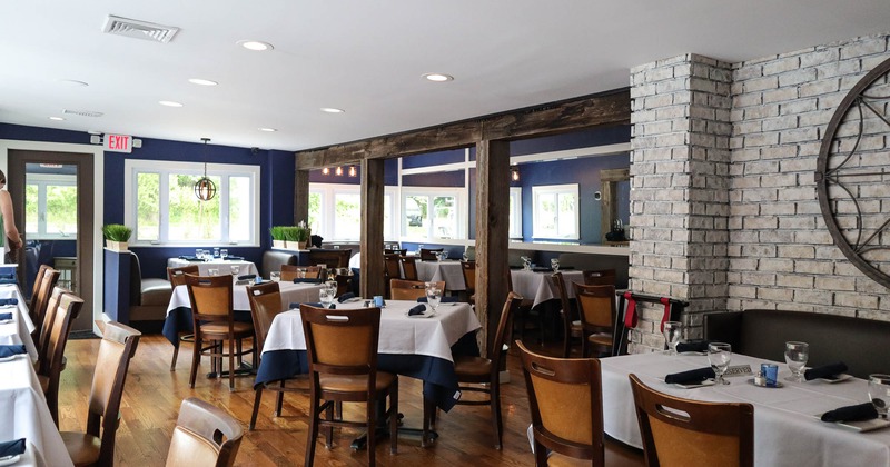 Interior, restaurant entrance, seating area, white brick wall