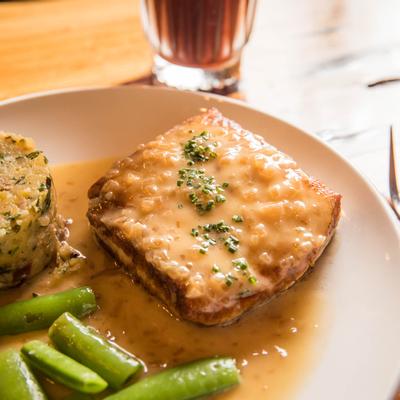Pan seared Halibut plate served with a drink