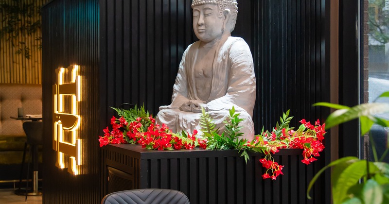 Interior, dining table, Buddha statue behind