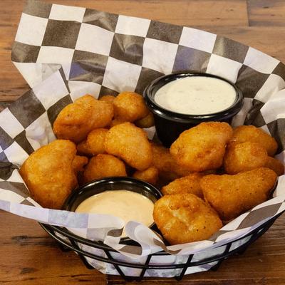 Fried Buffalo Cauliflower Bites served with two dipping sauces.