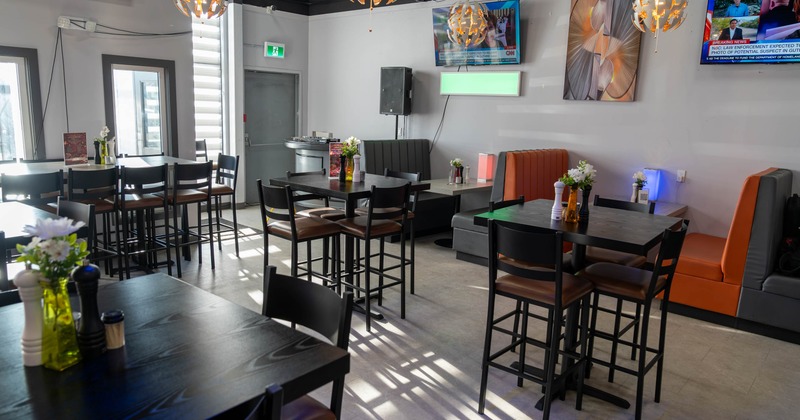 Interior seating area with chairs, tables and booths