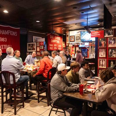 Guests dining at tables inside.