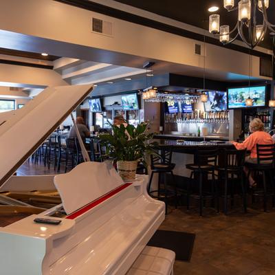 33 seat bar, baby grand piano for you to play and entertain us.