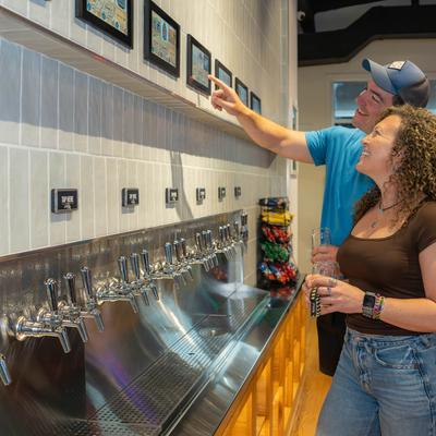 Customers browsing the beers.