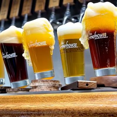 Beers rocking and spilling  at the bar.