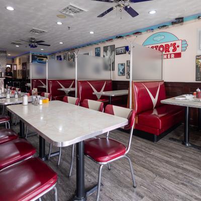 Dining area, retro decor, including red vinyl booths with white 