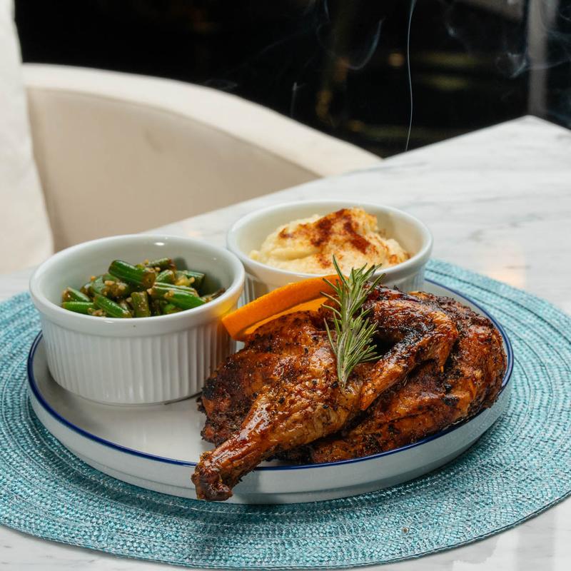 menu item 6 of 7, ½ Pan Roasted Black Truffle Oil Orange Herb Chicken with Berry Gastric