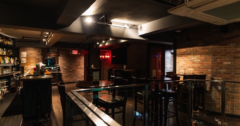 Gallery, wide view, tables, chairs, bar