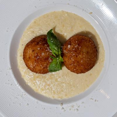 Deep fried rice balls, with pecorino cream sauce