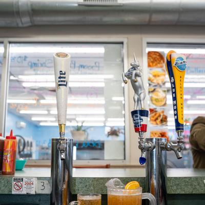 Beer dispensaries behind the bar.