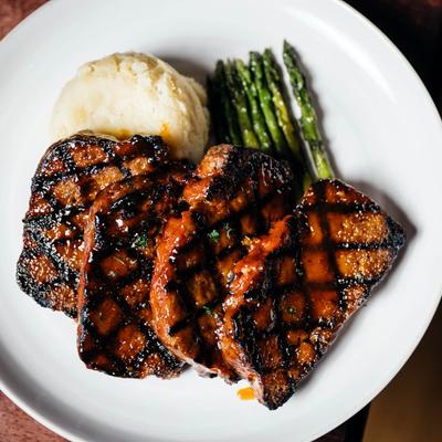 Char - Grilled Meatloaf with mashed potatoes and asparagus.