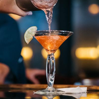 Pouring Cosmo into a glass