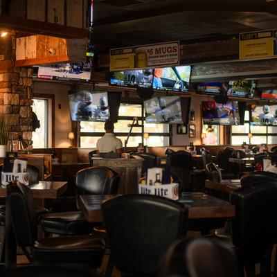 Diner area, tables and chairs, wide view.