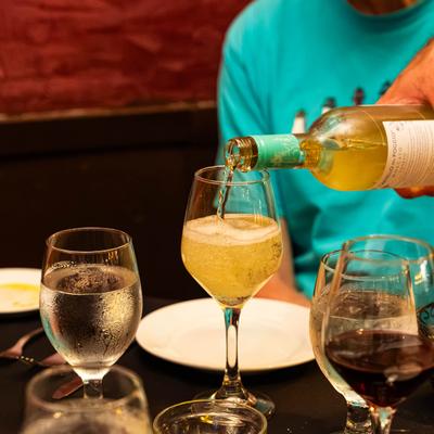 Pouring a glass of wine.