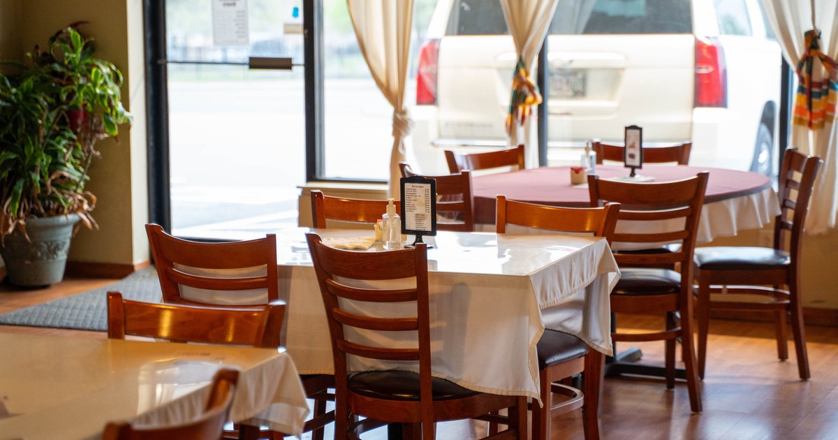Cozy restaurant interior with wooden chairs