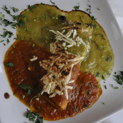 Rolled pastry with red and white dip