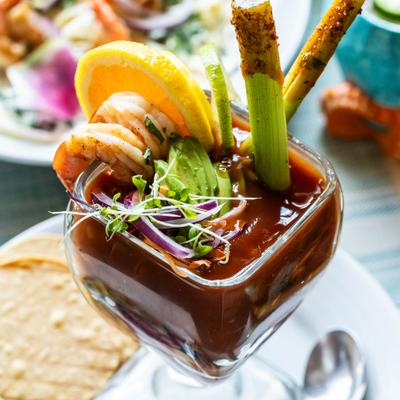 Shrimp cocktail with pico de Gallo, cucumbers, and avocado.